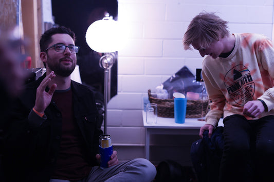 Comedians hanging out in a green room